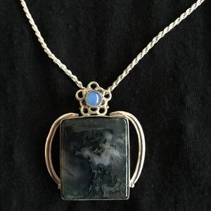 Sterling silver chain with pendant.